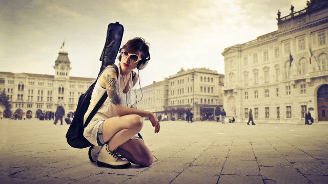 Woman kneeling guitar case backpack free wallpaper - medium preview image