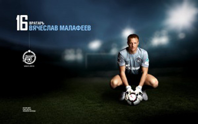 Man kneeling soccer ball grass free wallpaper - medium preview image