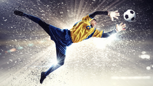 Man kicking soccer ball air #2 free wallpaper - medium preview image