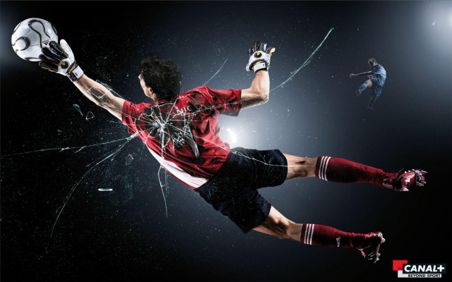 Man kicking soccer ball broken free wallpaper - medium preview image