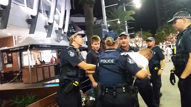 Police officers nighttime sidewalk palm free wallpaper - medium preview image
