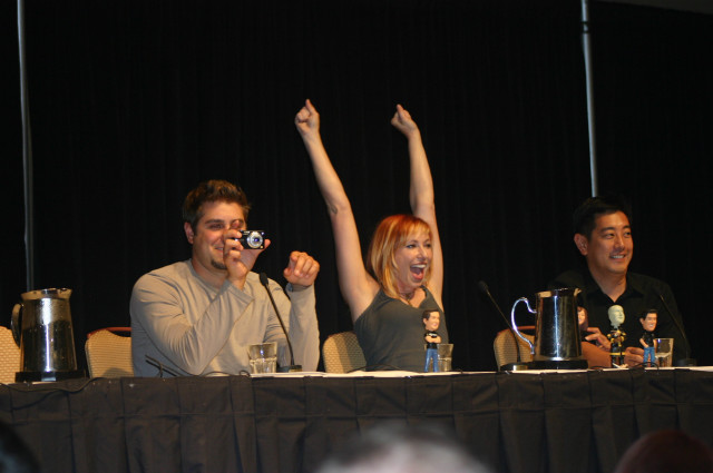 Group hands up table camera free wallpaper - medium preview image