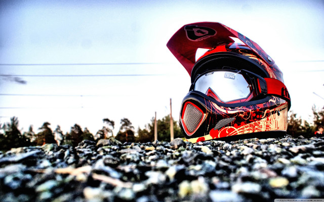 Helmet sitting ground sky background free wallpaper - medium preview image
