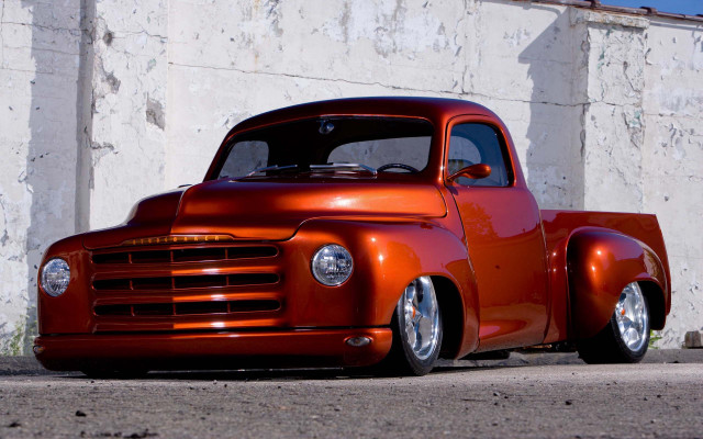 Red truck white building wall free wallpaper - medium preview image