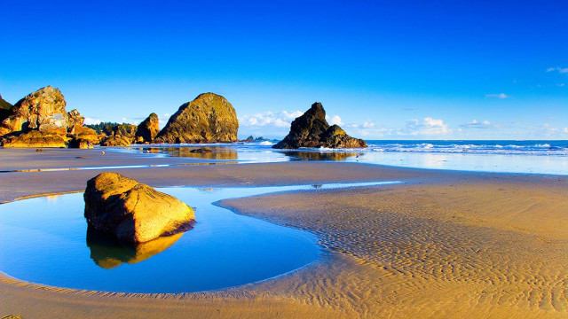 Beach rock formation water sky free wallpaper - medium preview image
