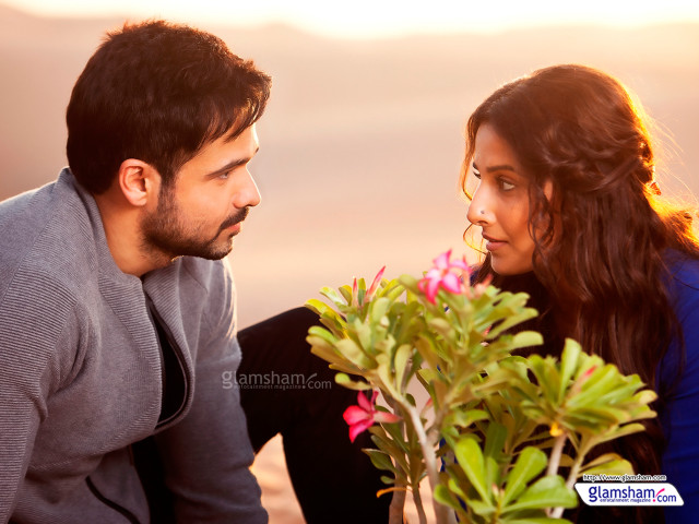 Man woman sitting looking plant free wallpaper - medium preview image