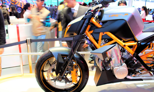 Motorcycle showroom display crowd people free wallpaper - medium preview image