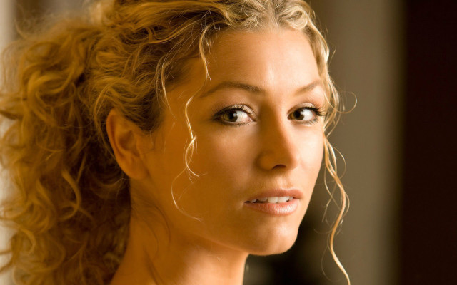 Blonde woman serious blue eyes free wallpaper - medium preview image