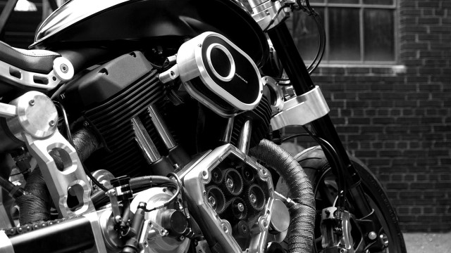 Motorcycle parked brick building clock free wallpaper - medium preview image