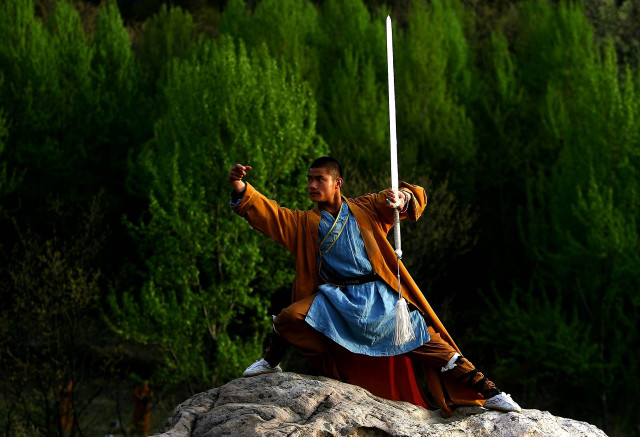 Man costume sword rock forest free wallpaper - medium preview image