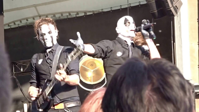 Man guitar mask stage crowd free wallpaper - medium preview image