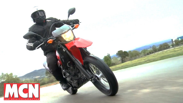 Man riding red motorcycle street free wallpaper - medium preview image