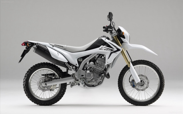 White motorcycle parked white floor free wallpaper - medium preview image