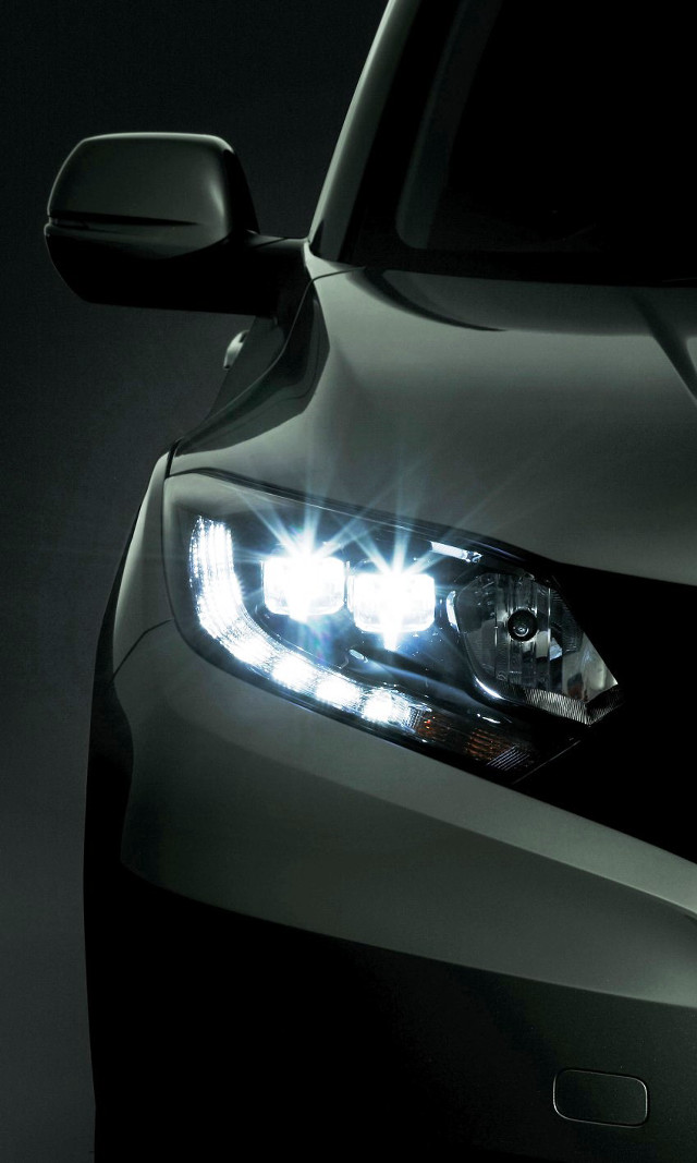 Car headlight closeup dark background free wallpaper - medium preview image