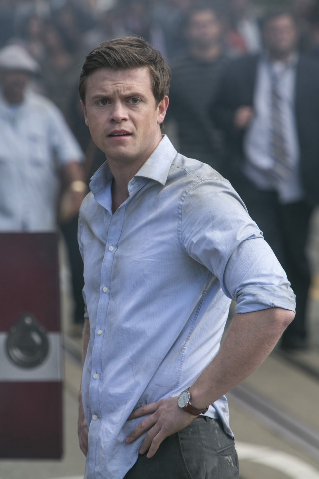 Man standing crowd blue shirt free wallpaper - medium preview image