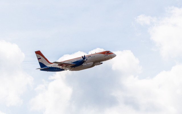 Jetliner red blue tail cloudy free wallpaper - medium preview image