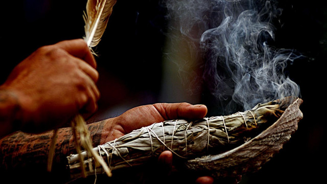 Person holding feather pipe smoke free wallpaper - medium preview image