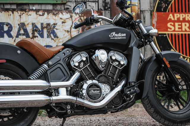 Motorcycle parked rusty building sign free wallpaper - medium preview image