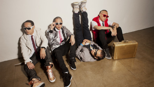 Men sitting suitcase sunglasses group free wallpaper - medium preview image