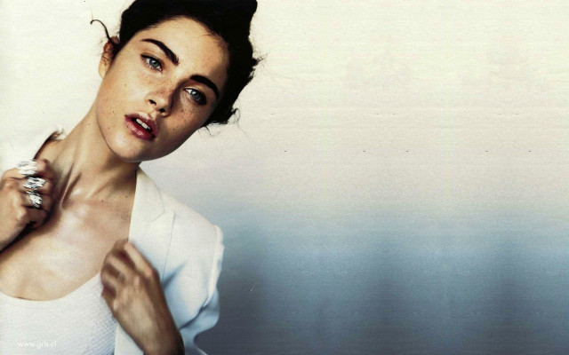 Woman white shirt holding ring free wallpaper - medium preview image