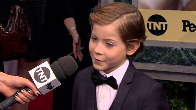 Young boy tuxedo interview reporter free wallpaper - medium preview image