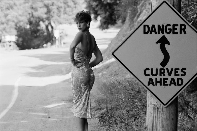 Woman danger curves ahead road free wallpaper - medium preview image
