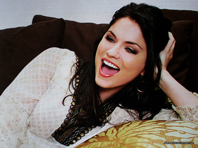 Woman couch smiling hands head free wallpaper - medium preview image