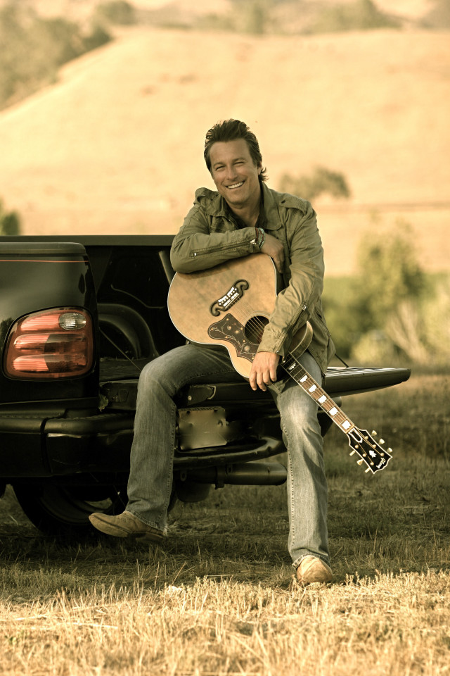 Man truck guitar smiling camera free wallpaper - medium preview image