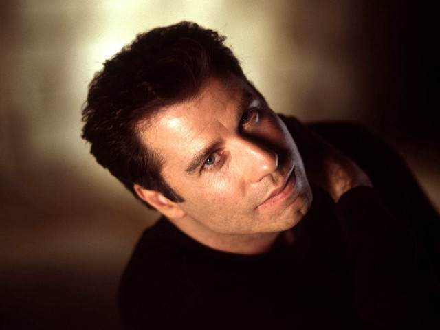 Man black shirt leaning wall #2 free wallpaper - medium preview image
