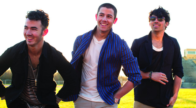 Three men field grass building free wallpaper - medium preview image