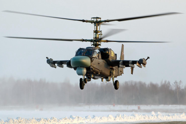 Helicopter flying low snowy field free wallpaper - medium preview image