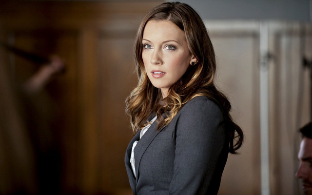 Woman suit room man serious free wallpaper - medium preview image