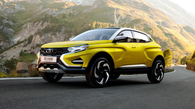 Yellow suv driving road mountain free wallpaper - medium preview image