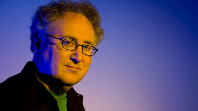 Man glasses green shirt serious free wallpaper - medium preview image
