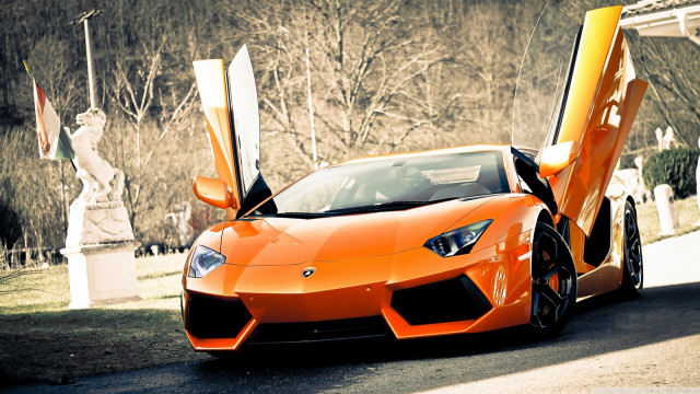 Orange sports car parked street #4 free wallpaper - medium preview image