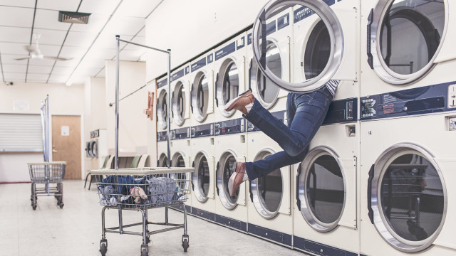 Laundry room man hanging washing free wallpaper - medium preview image
