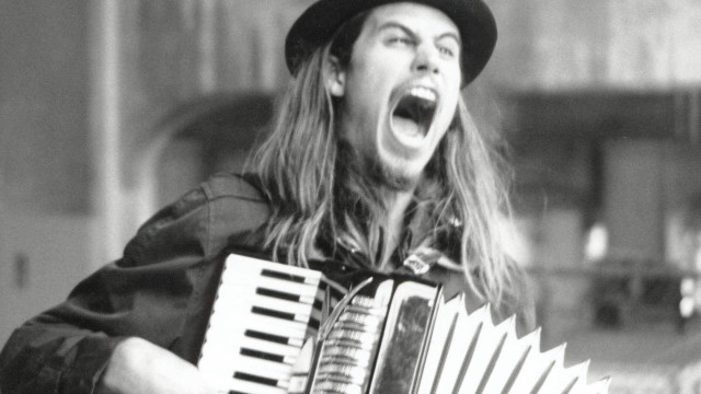 Long haired man hat accordion free wallpaper - medium preview image