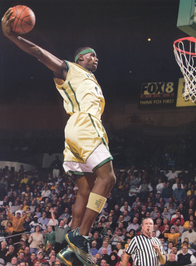 Man yellow uniform dunking basketball free wallpaper - medium preview image