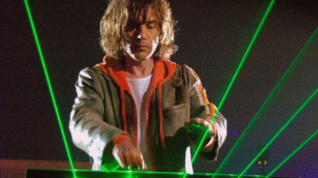 Man standing laptop stage green free wallpaper - medium preview image