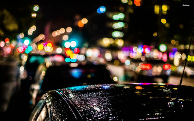 Car parked busy street night #2 free wallpaper - medium preview image