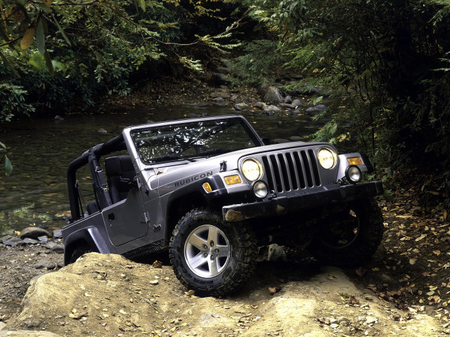 Jeep parked rock stream trees free wallpaper - medium preview image