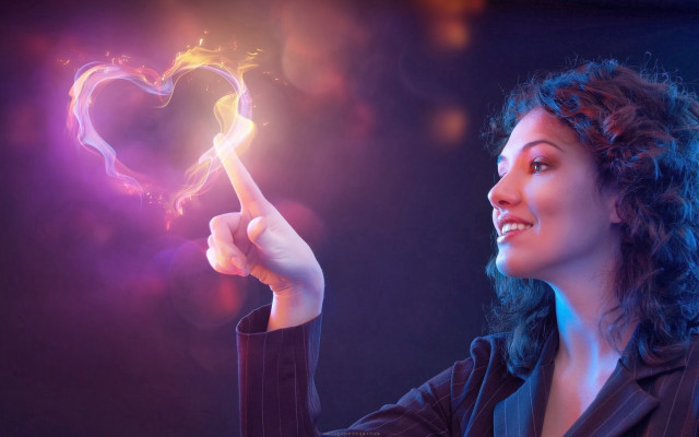 Woman holding heart shaped object #2 free wallpaper - medium preview image