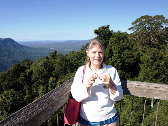 Woman wooden balcony mountains trees free wallpaper - medium preview image