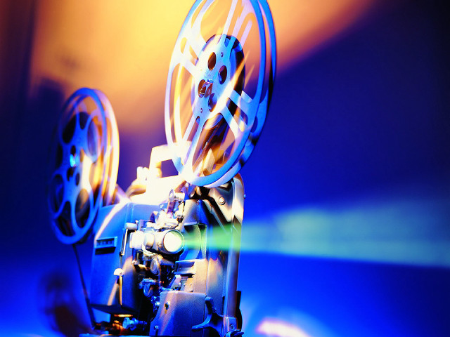 Movie projector blue background blurry free wallpaper - medium preview image