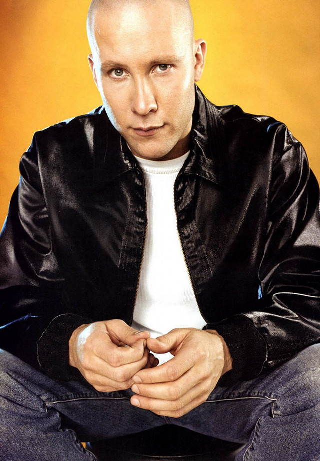 Bald man black jacket jeans free wallpaper - medium preview image