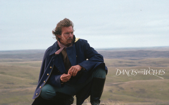 Man blue coat tie crouching free wallpaper - medium preview image