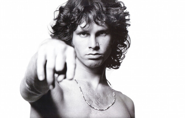 Man pointing camera shirt necklace free wallpaper - medium preview image
