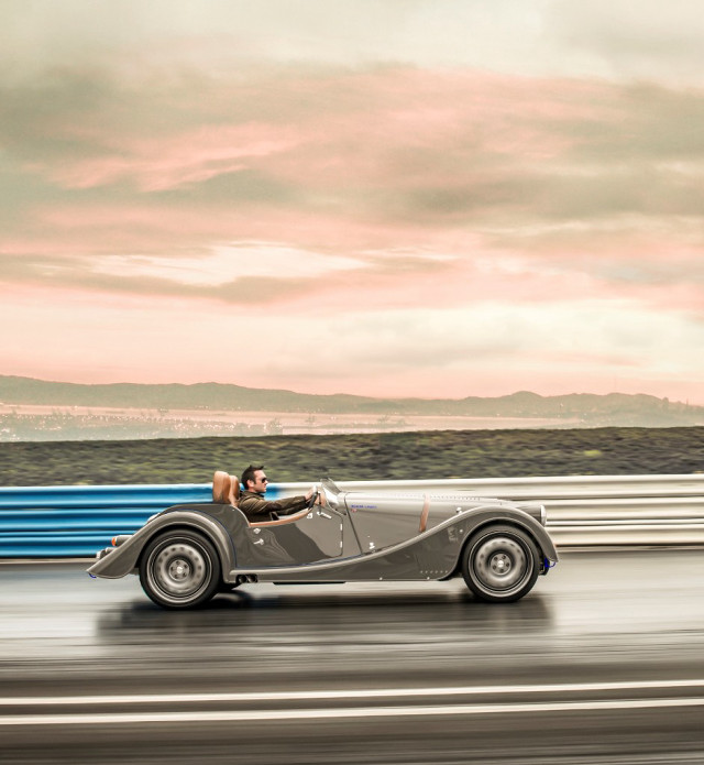 Vintage car driving road sky free wallpaper - medium preview image