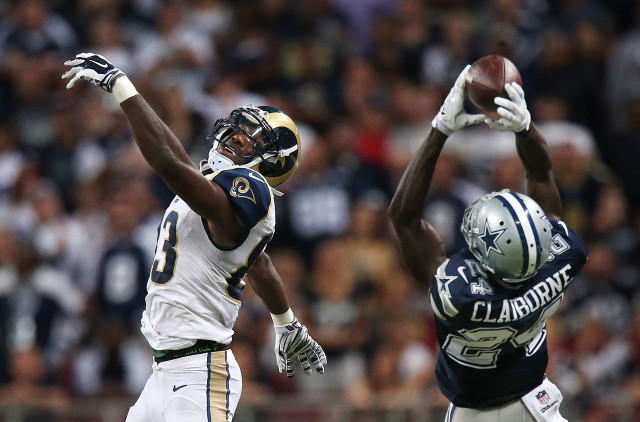 Football players jumping catching ball free wallpaper - medium preview image