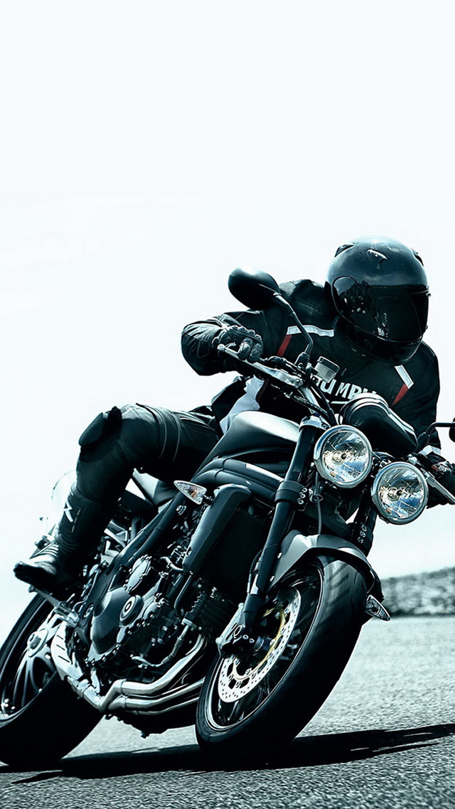Man motorcycle street rock wall free wallpaper - medium preview image